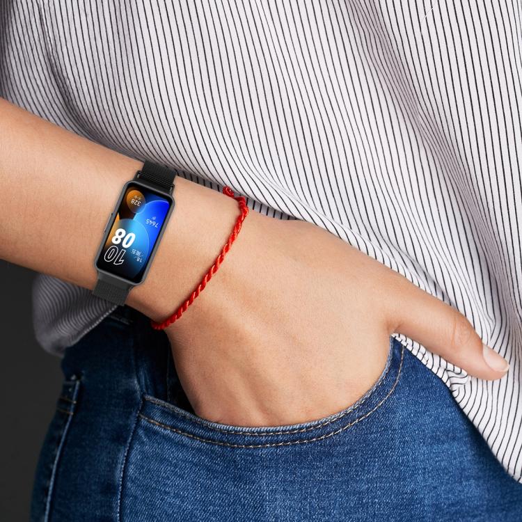 Smartwatch worn on wrist with a black band