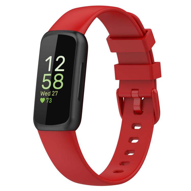 Fitbit Inspire 3 with a red silicone watch band and black tracker