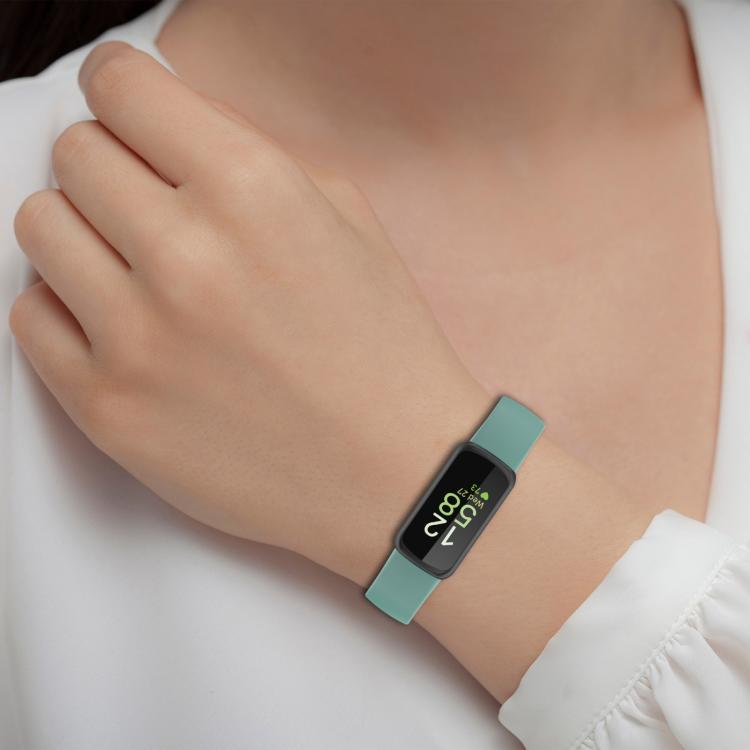 Fitbit Inspire 3 silicone watch band in teal, worn on a wrist