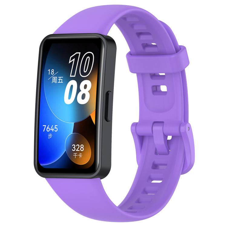 Purple silicone watch band with buckle and adjustment holes, shown attached to a smartwatch.