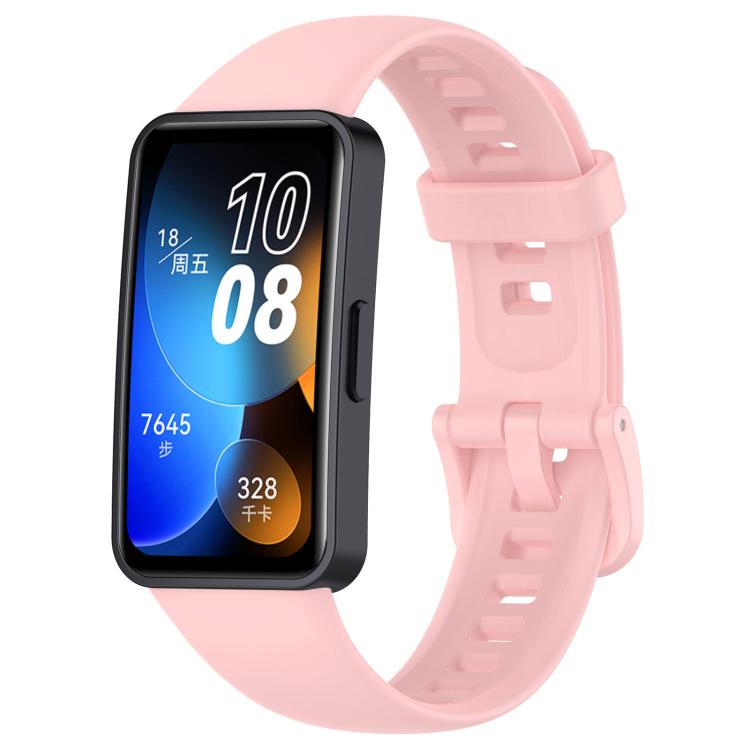 Pink silicone watch band with buckle and adjustment holes, shown attached to a smartwatch.