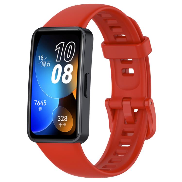 Red silicone watch band with buckle and adjustment holes, shown attached to a smartwatch.