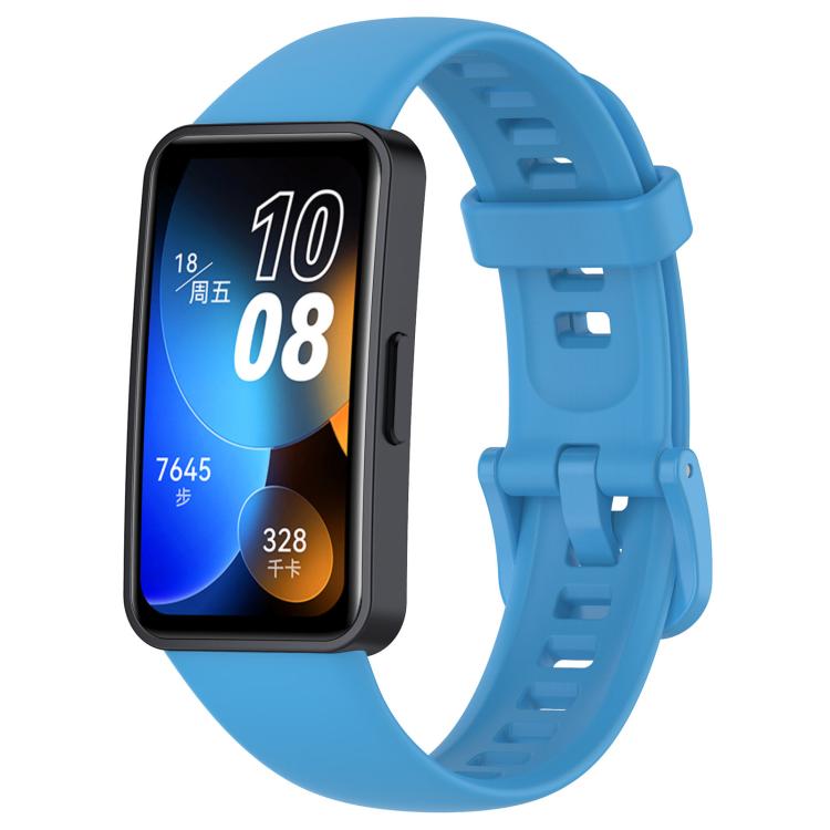 Blue silicone watch band with buckle and adjustment holes, shown attached to a smartwatch.