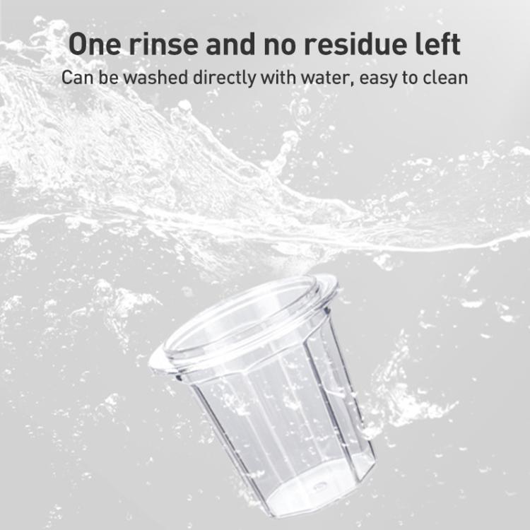 Clear plastic coffee dosing cup shown during rinse, easy-to-clean container