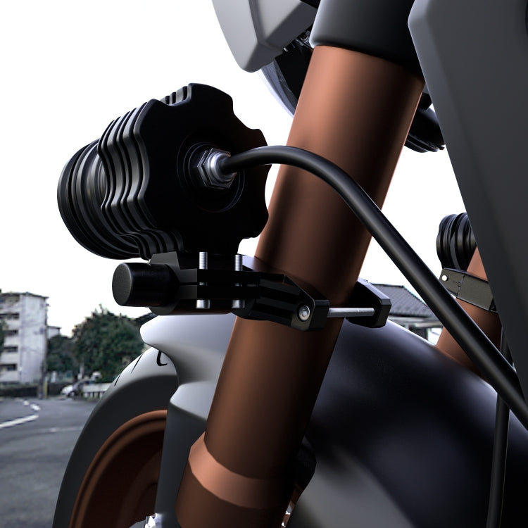 Motorcycle spotlight mounting bracket with one round LED spotlight on fork