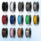 Assorted 3D filament spools in black, white, gray, red, blue, and more
