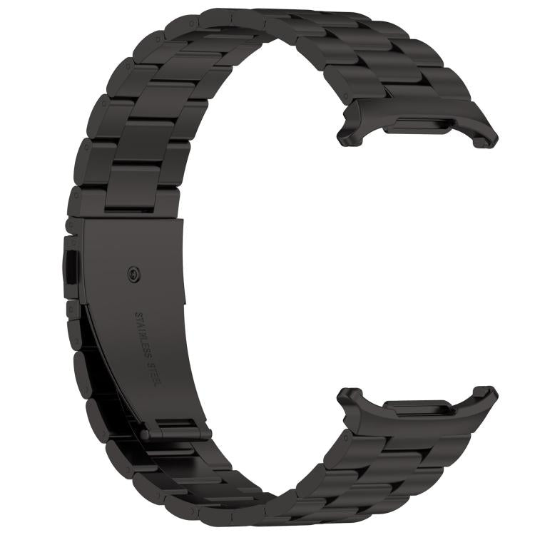 Reverse view of detached black three-bead metal watch band and clasp