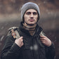 Man wearing dark heather fleece beanie hat with ribbed edge
