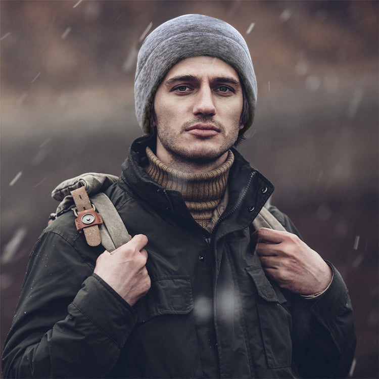 Man wearing dark heather fleece beanie hat with ribbed edge