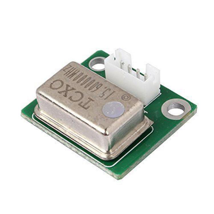 TCXO crystal oscillator module with metal can on green PCB and 3-pin header