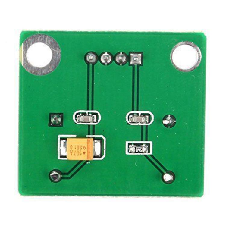 Green PCB oscillator module with SMD components and two large mounting holes