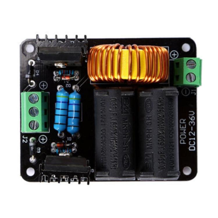 Black power module PCB with copper inductor coil, blue capacitors, and green connectors