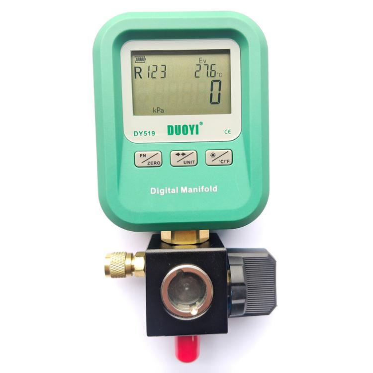 Digital manifold gauge with LCD screen, brass ports, green housing and black control valve