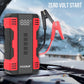 Red-and-black FOXSUR jump starter with jumper cable clamps and LCD voltage readout