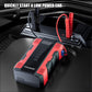 Red-and-black FOXSUR jump starter air compressor in a car cargo area with cables