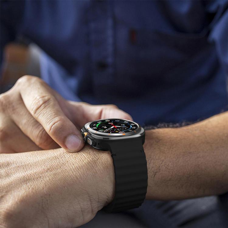 Black ridged silicone watch band worn on the wrist