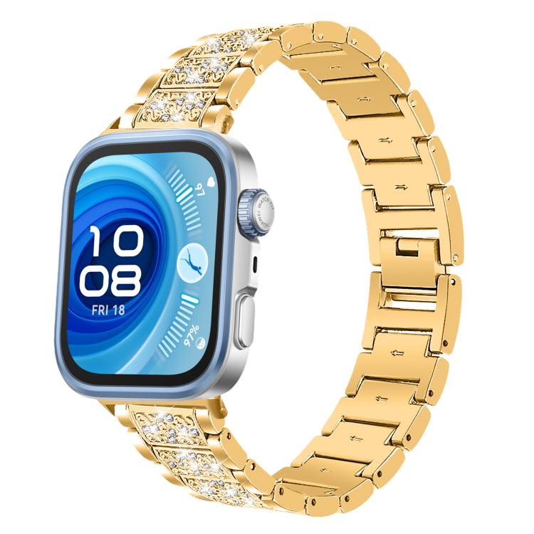 Gold stainless steel watch band with sparkling crystal links, shown on a square smartwatch.