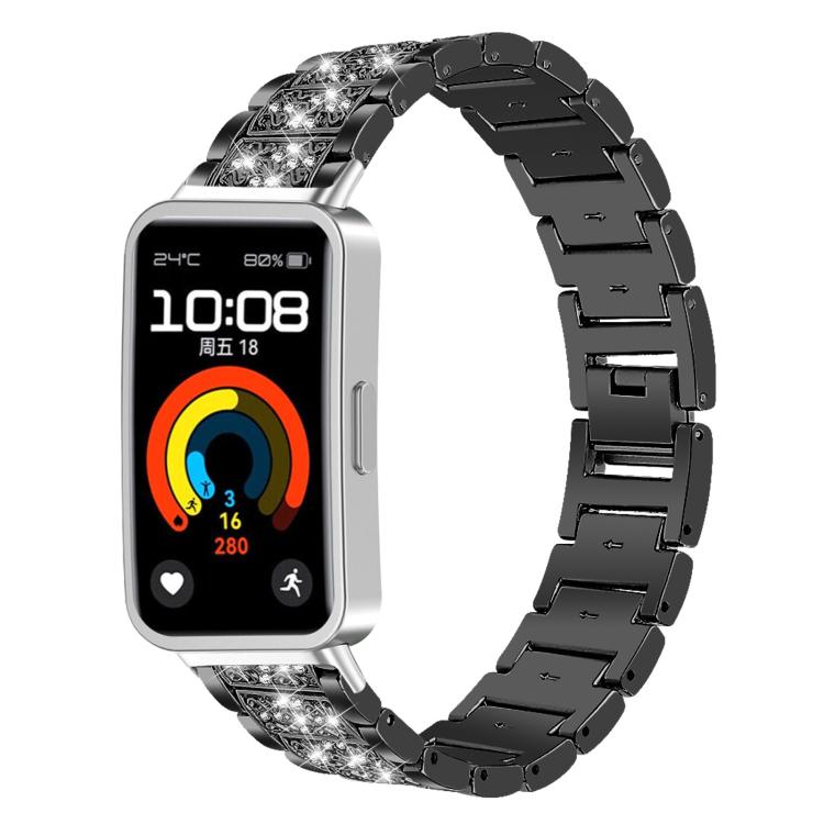 Black stainless steel watch band with crystal-accented links, fitted to a rectangular fitness watch.