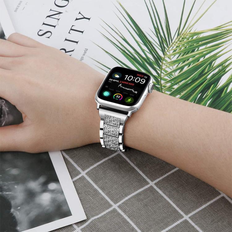 Silver stone-set stainless steel watch band worn with a smartwatch.