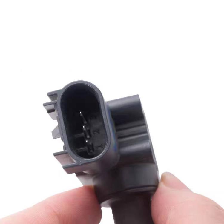 Brake fluid pressure sensor connector view, black housing held by hand