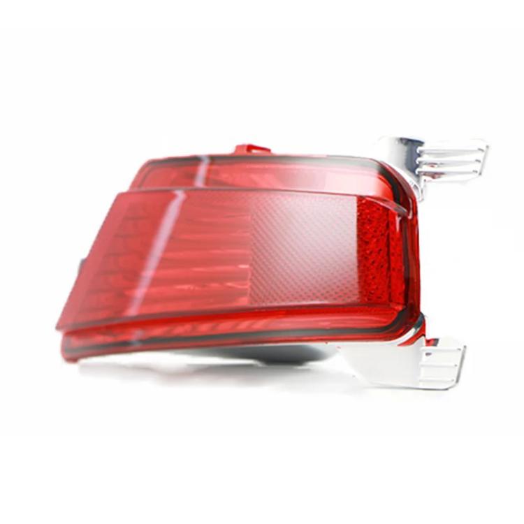Rear bumper fog light corner view with red lens and reflector texture