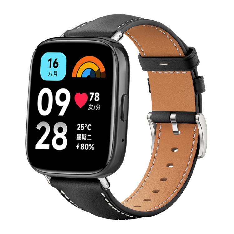 Black leather watch band with tan lining, contrast stitching and silver buckle on a smartwatch with digital display