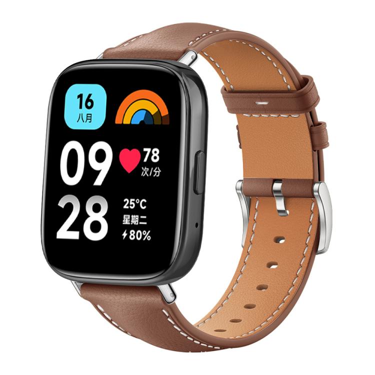 Brown leather watch band with tan lining, contrast stitching and silver buckle on a smartwatch with digital display