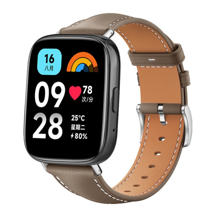 Taupe leather watch band with tan lining, contrast stitching and silver buckle on a smartwatch with digital display