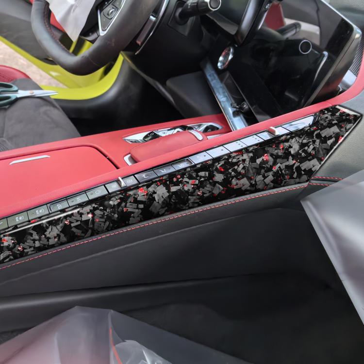 Left driver center console side decal strip, black carbon-fiber with red speckles