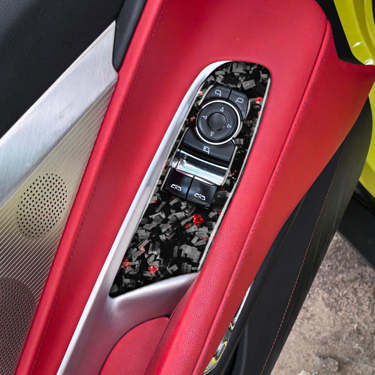Left driver window lift trim stickers installed on center console, black carbon-fiber with red flecks