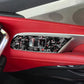 Window lift trim sticker set installed on car door panel, black carbon-fiber with red accents