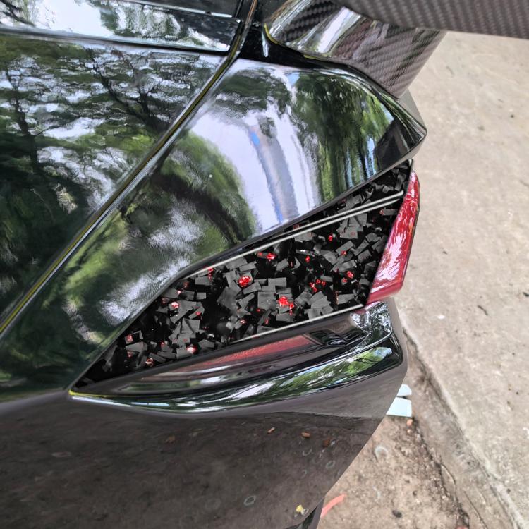 Carbon fiber taillight side overlay sticker with red mosaic pattern and chrome trim