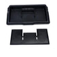 Black dashboard storage tray with molded partitions and removable textured inserts