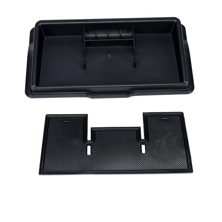 Black dashboard storage tray with molded partitions and removable textured inserts