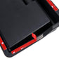 Black dashboard storage box corner with protective film tabs, close-up