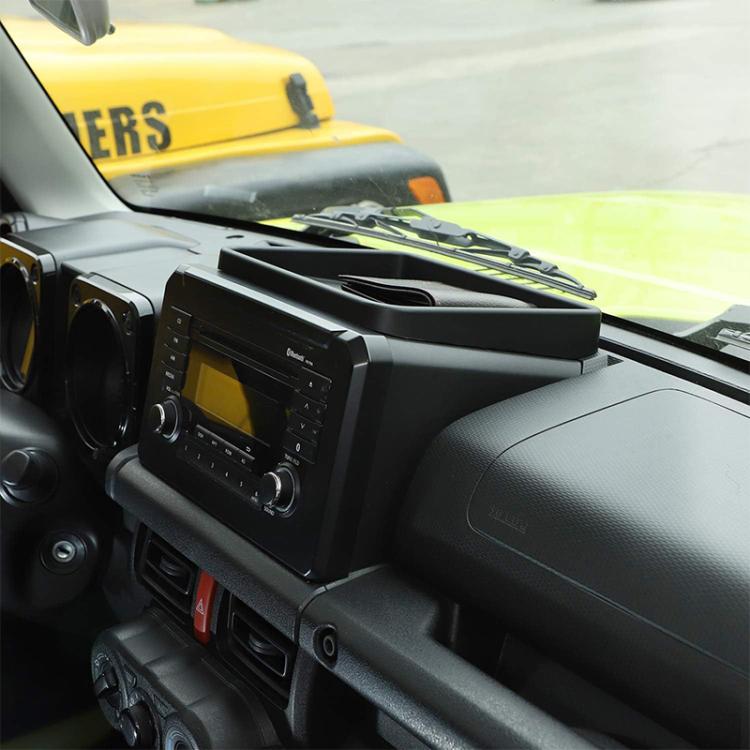 Dashboard storage tray mounted on car dashboard near center console