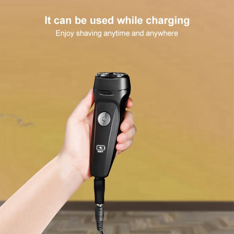 Black shaver with attached charging adapter cable and DC plug