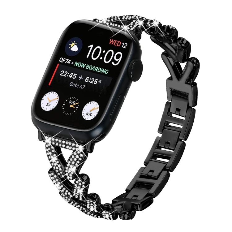 Black metal Apple Watch band with crystal-studded clover links and polished clasp