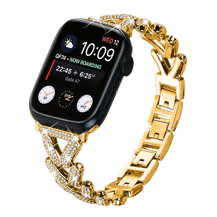 Gold-tone metal Apple Watch band with crystal-studded clover links