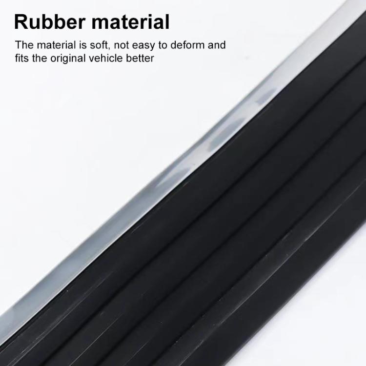 Close-up of black rubber anti-collision strip with ribbed texture and silver edge.