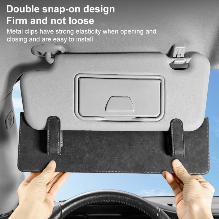 Black sun visor card extension clip with double-snap design, hands pressing onto the visor