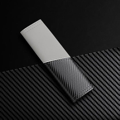 White leather seat belt shoulder guard with carbon-fiber texture panel