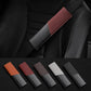 Red leather seat belt shoulder guard with carbon-fiber texture on car seat