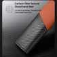 Car seat belt shoulder guard with orange leather edging and carbon-fiber weave panel