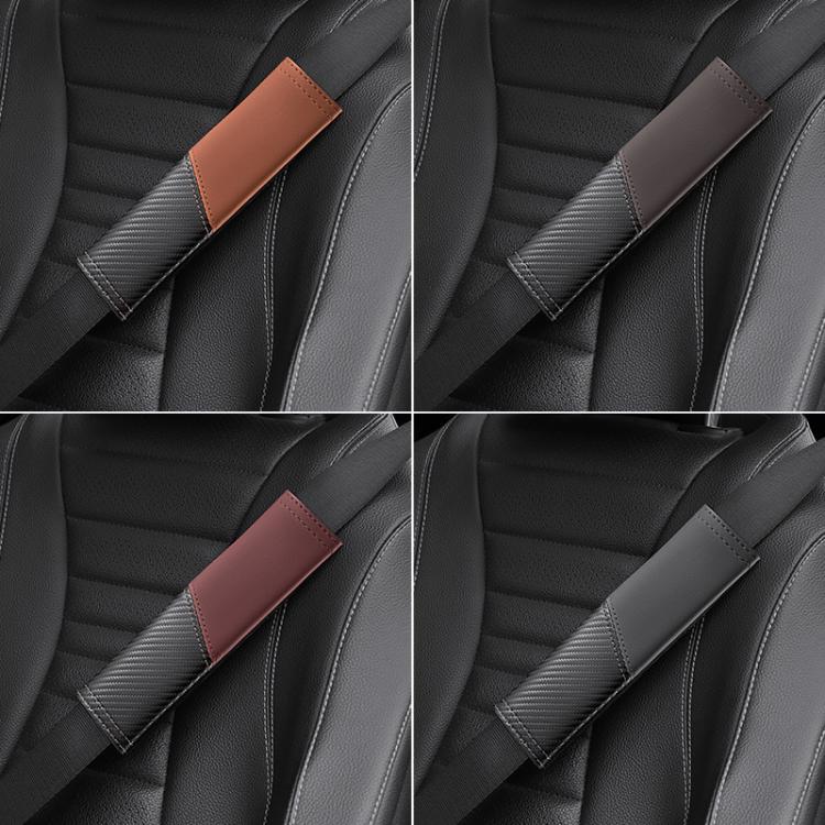 Car seat belt shoulder guards on car seats with carbon-fiber panel and leather tabs in dark tones