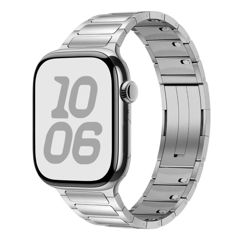 Silver stainless steel Apple Watch band with linked tri-bead design, shown attached to a watch.