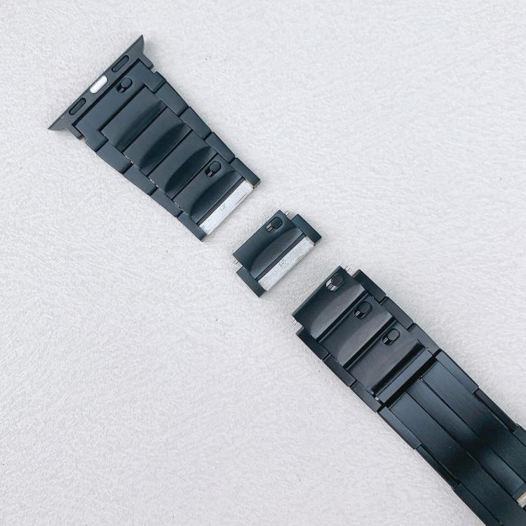 Black watch band with a detachable link separated between the two band sections.