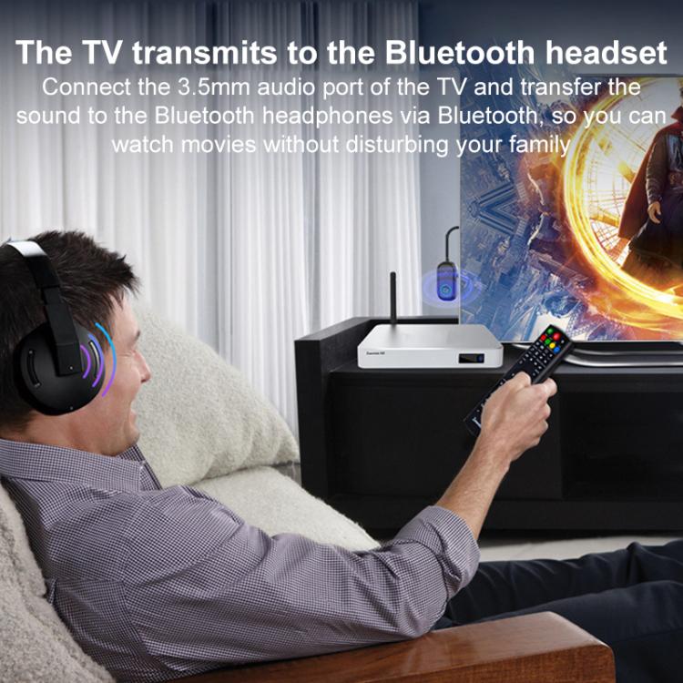 Bluetooth AUX audio adapter connected to TV sound output, compact dark transmitter device
