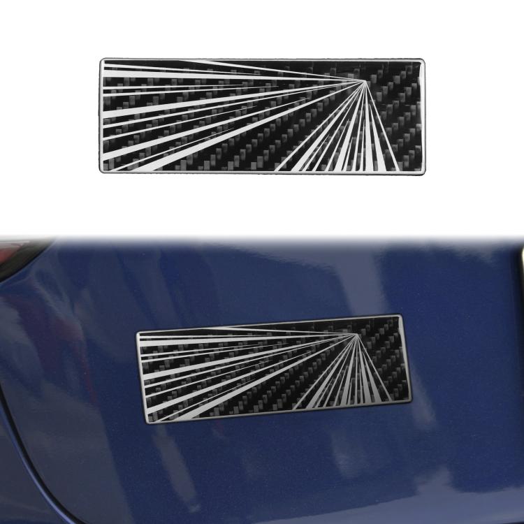 Rectangular black carbon-fiber style sticker with white radial burst and diagonal rays