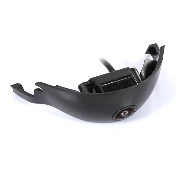 Front bumper camera with black housing and circular lens, mounting clips attached
